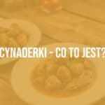 A plate of cooked cynaderki (animal kidneys) served with herbs and sauce, rustic wooden table, warm lighting, traditional Polish cuisine, realistic.